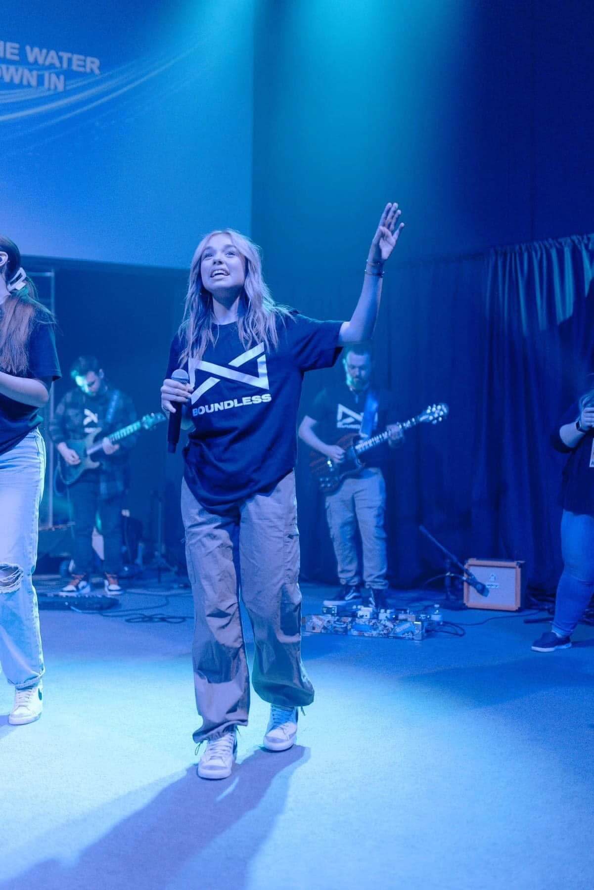 Worship team wearing matching Boundless church shirts on stage