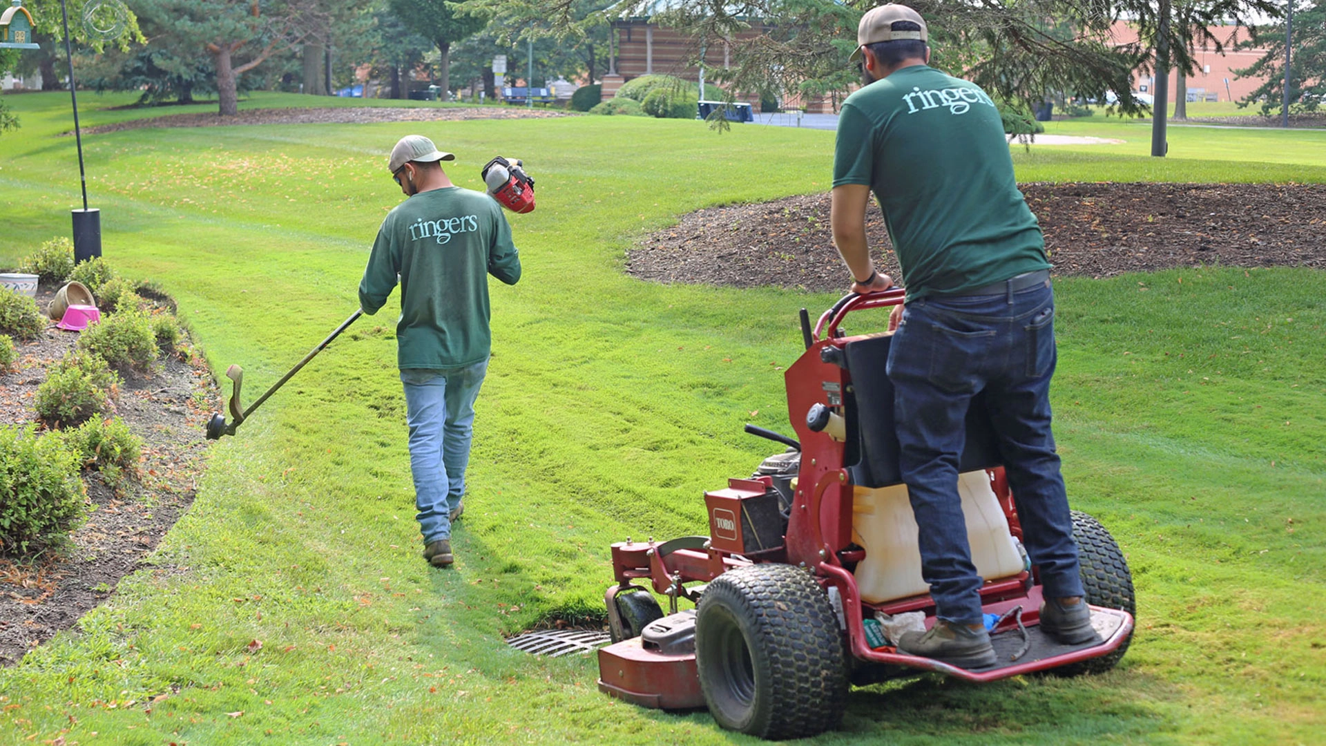 Ringers landscaping crew wearing custom company work shirts