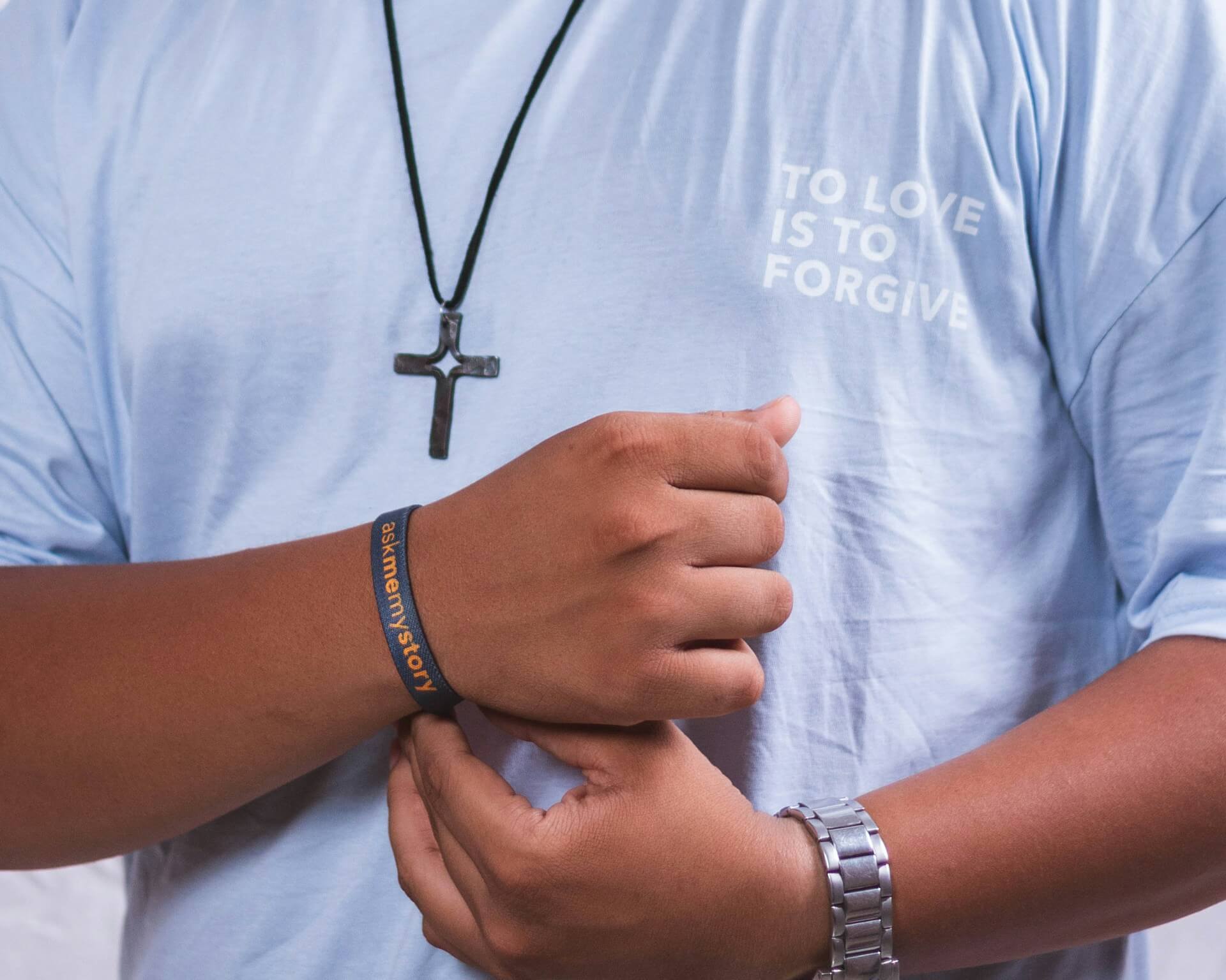 Light blue church shirt with a small To Love Is To Forgive front print
